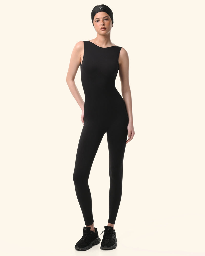 Person wearing a black sleeveless jumpsuit on a white background %Black%