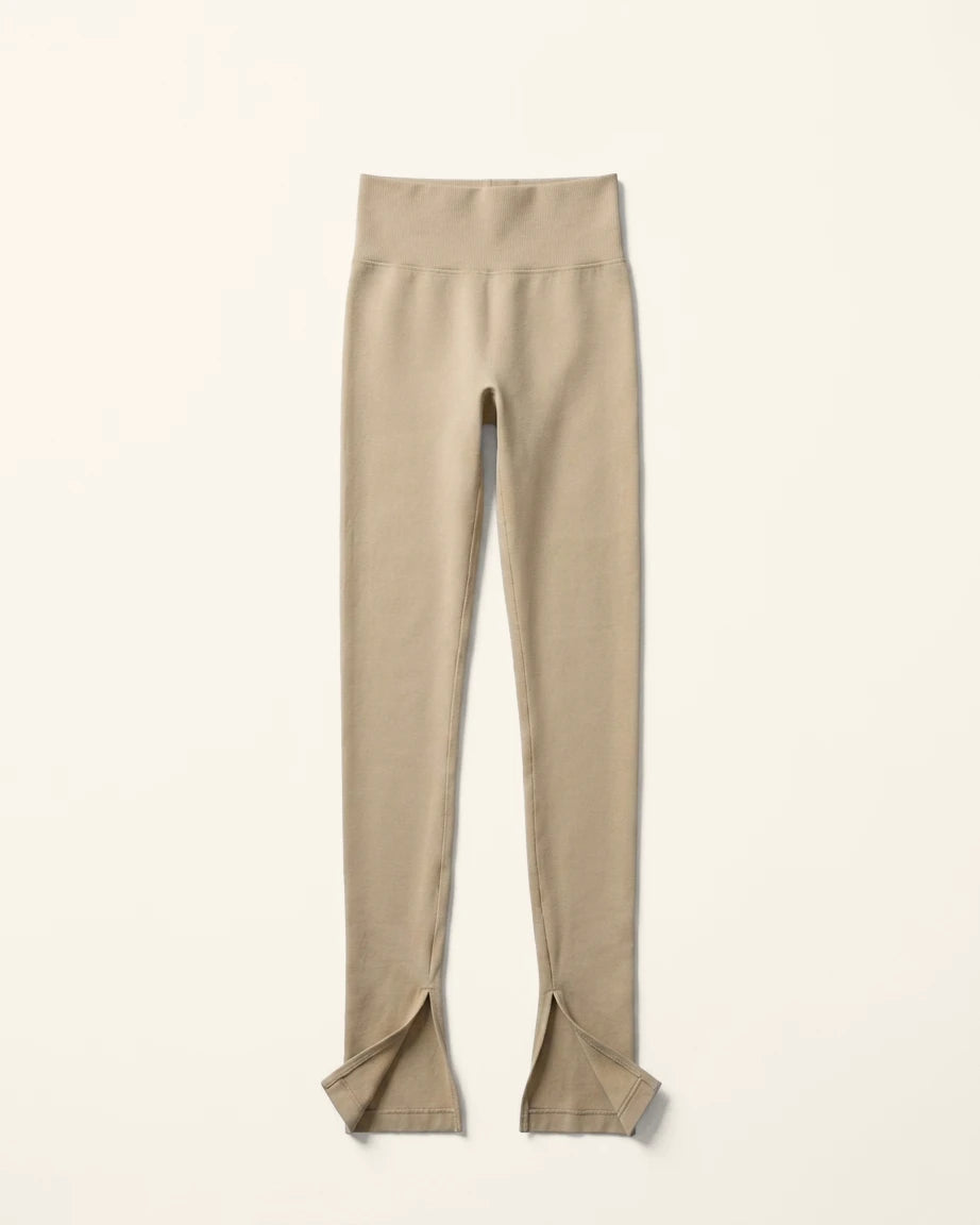 Beige leggings with a slit on a white background %Cream%