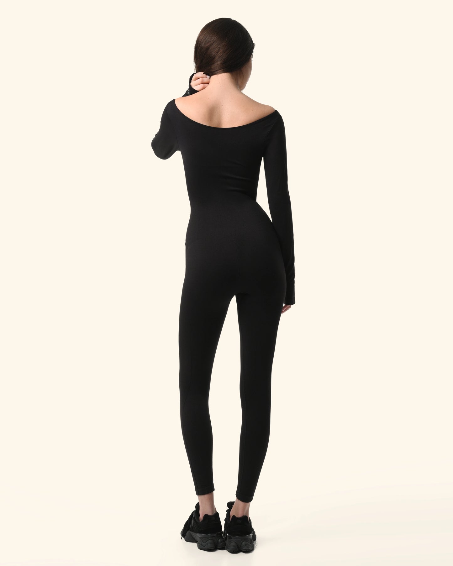 Person wearing a black bodysuit on a white background %Black%