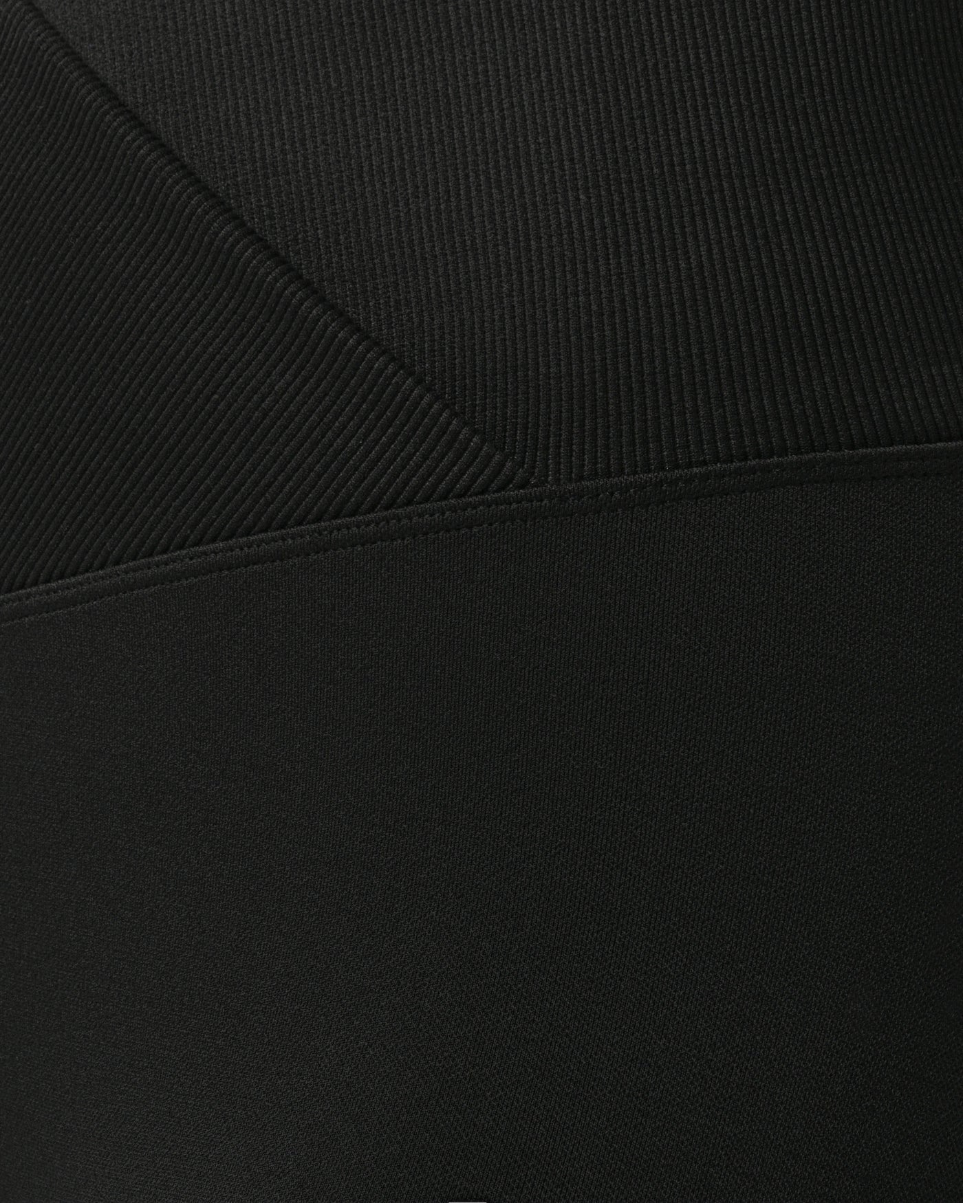 Close-up of black fabric with a subtle texture %Black%