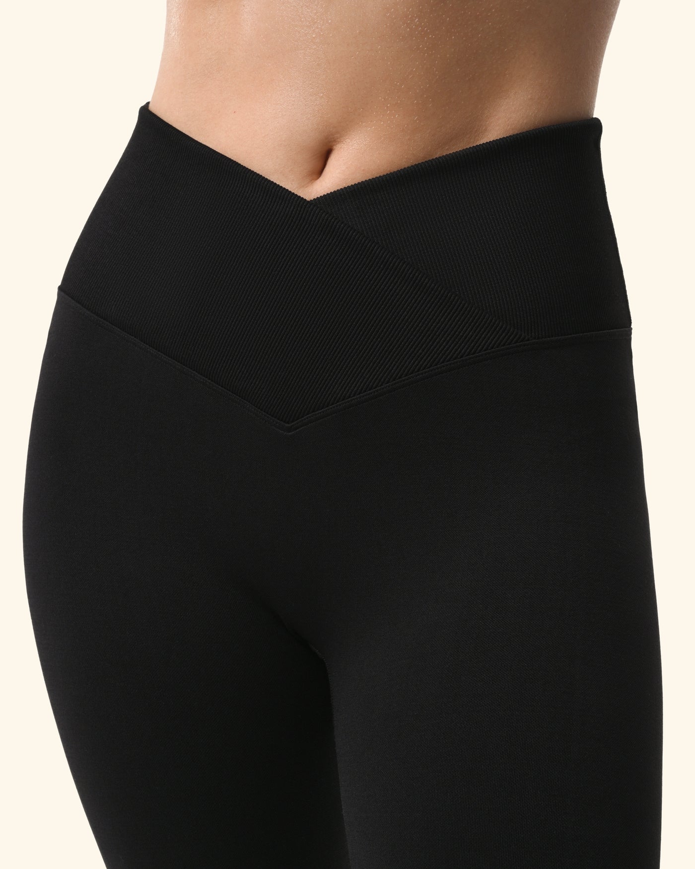 Black leggings worn by a person on a white background %Black%