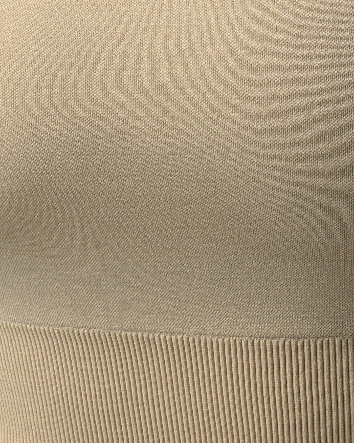 Close-up of beige fabric with ribbed texture %Cream%